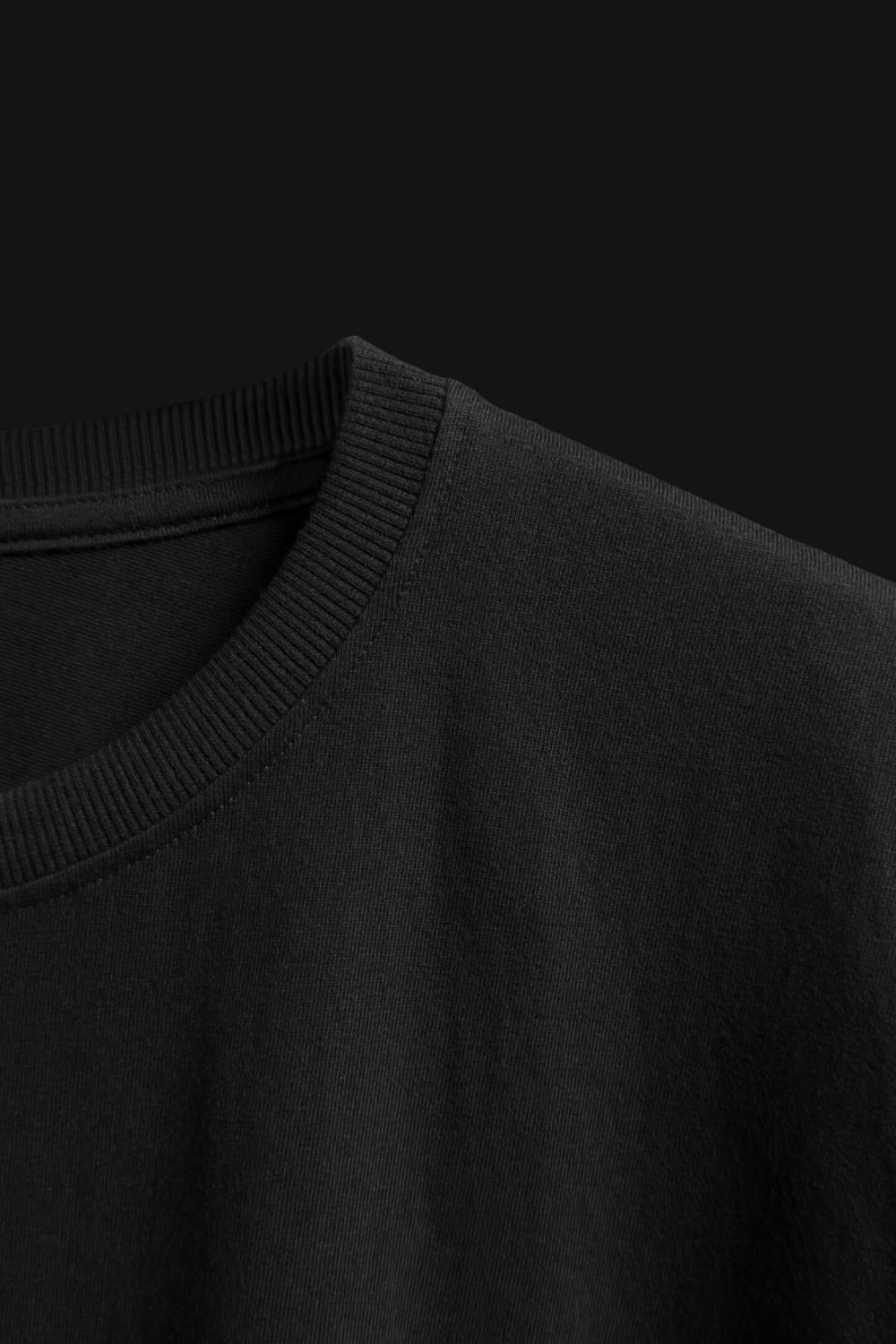 FalconMoose Noir Signature black oversized t-shirt right side close-up half front view ribbed neck and shoulder detail